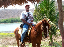 Byron riding horseback on vacation