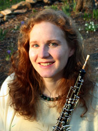 Alisa holds her oboe, which she enjoys playing for chamber music groups