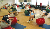 Barry teaching classes using large stability-exercise balls