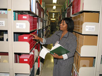 Crystal Smith checks references and retrieves books for NLM patrons.