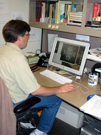 David Belnap sits at his desk to work on molecular models.