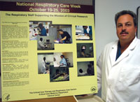 Dennis Brown coordinates promotion of the National Respiratory Care Week at the NIH. He helped design the poster that shows how the respiratory staff makes important contributions to patient care at the Clinical Center.