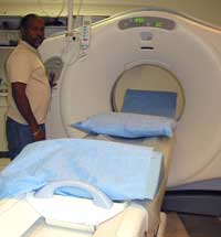 Dennis Johnson is pictured next to one of three CT scanners operated by staff in the Department of Radiology.