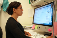 Jennifer spends time at her desk, analyzing data and reviewing the latest published research in her field.