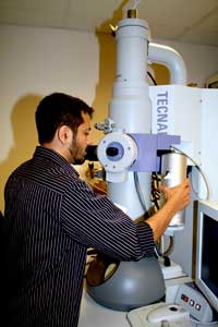 Kedar uses the transmission electron microscope (as shown) to take high resolution images of cells. 