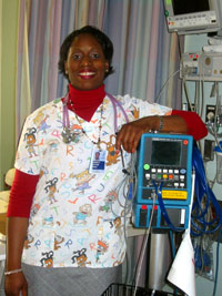 Keisha Potter prepares to monitor a patient using a blood pressure cuff.