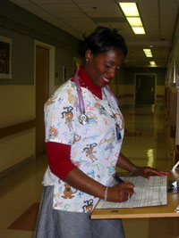 Keisha Potter updates patient status reports.
