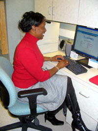 Keisha Potter tracks patient information using the Clinical Research Information System (CRIS).