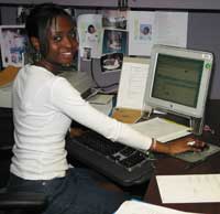 Kevilin at her desk in the NIH Office of Science Education where she worked part-time while going to college.