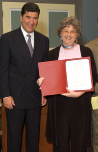 Linda Doty accepts an award from NIH Director, Elias A. Zerhouni, M.D., for her participation in Share the Health Day, April 2004.