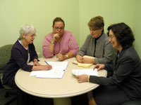 Malka Scher and other Technology Transfer Branch employees work on a clinical trial agreement.
