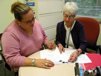 Malka Scher advises a colleague on a material transfer agreement.