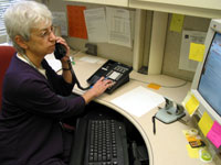 Malka Scher returns a phone call at her desk.