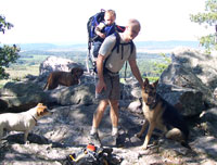 Mattew Scherer hiking with his son and dogs.