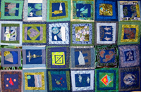 Shown is a quilt completed by patients and staff as a symbol of the collaborative efforts on the unit.