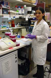 Patricia Diaz conducts an experiment at her lab bench.