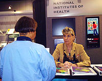 Peggy Deichstetter talks to a teacher about the NIH Curriculum Supplements at the National Science Teachers Association convention in Atlanta, Georgia.
