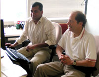 Post doctoral fellow, Sudhir Varma, and Richard Simon review a data analysis.
