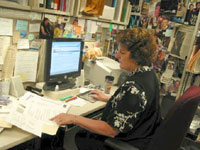 Robin Meckley working at her desk.