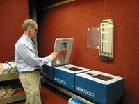 Ron DeClerck uses a mobile tram-like system that shuttles patient’s medical records to NIH clinics.