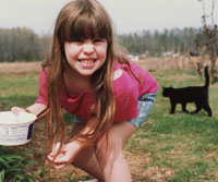 As child growing up in rural Alabama, Tracy had a pet goose and is pictured here collecting eggs.