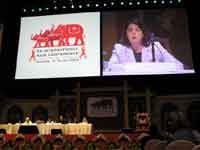 W. Tun gives a presentation on HIV Treatment Optimism at the International AIDS Conference in Bankok, Thailand (2004).