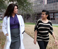 Yvonne chats with a colleague as they walk around the medical center campus.